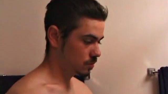 Marcus makes a manly impression as he slips away to the bathroom with his laptop to catch a little private time. He gets really into the porn he's watching and strips off his red boxers.