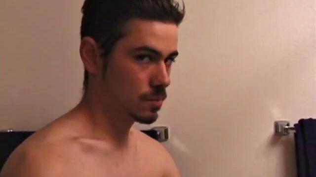 Marcus makes a manly impression as he slips away to the bathroom with his laptop to catch a little private time. He gets really into the porn he's watching and strips off his red boxers.