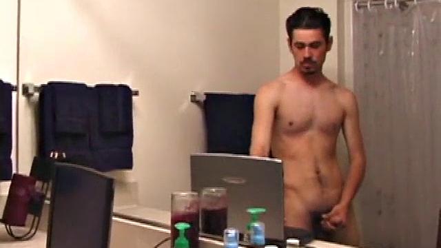 Marcus makes a manly impression as he slips away to the bathroom with his laptop to catch a little private time. He gets really into the porn he's watching and strips off his red boxers.