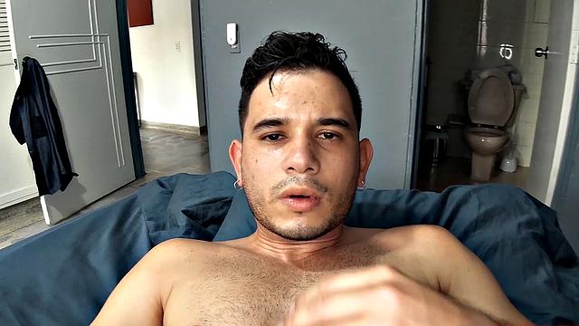 Avel pushes underwear down, fingers his asshole, works up a stiff one, strokes big cock, edges toward climax