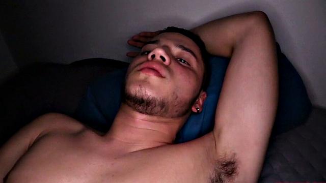 We look in on Vasco, who is stripped to his underwear and kicked back on a bed. He pulls his cock out and quickly gets it hard. Then the horny Latino gets completely naked, before getting down to business.