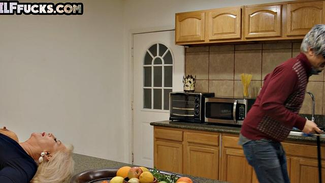 Boobylicious Granny in lingerie fucked in kitchen by stud