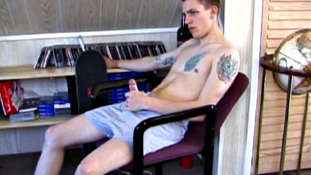 In this solo jerk off scene, young Shane strokes his hard cock to a porn video. He works that meat with determination, unloading warm cum onto his stomach.