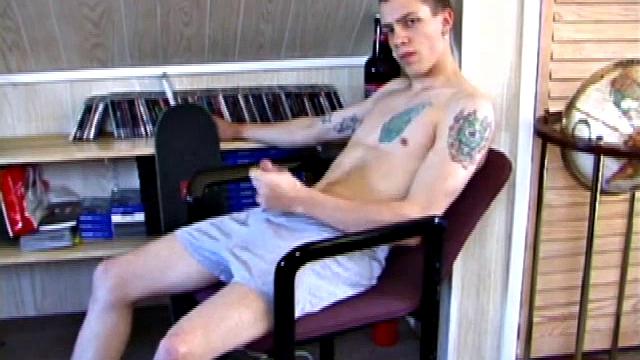 In this solo jerk off scene, young Shane strokes his hard cock to a porn video. He works that meat with determination, unloading warm cum onto his stomach.