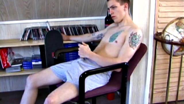 In this solo jerk off scene, young Shane strokes his hard cock to a porn video. He works that meat with determination, unloading warm cum onto his stomach.
