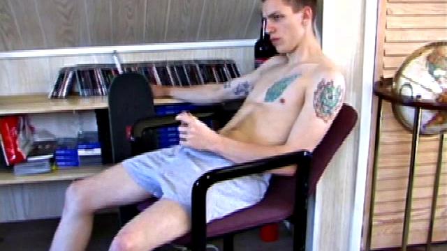 In this solo jerk off scene, young Shane strokes his hard cock to a porn video. He works that meat with determination, unloading warm cum onto his stomach.