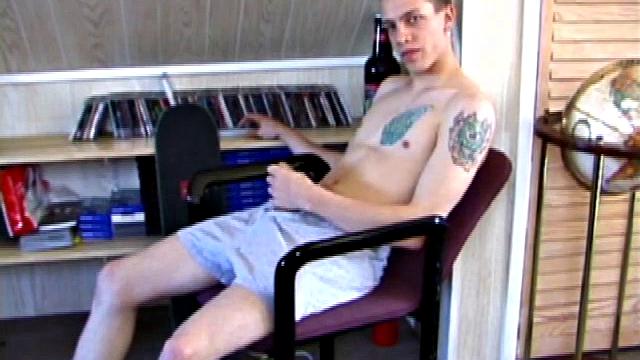 In this solo jerk off scene, young Shane strokes his hard cock to a porn video. He works that meat with determination, unloading warm cum onto his stomach.