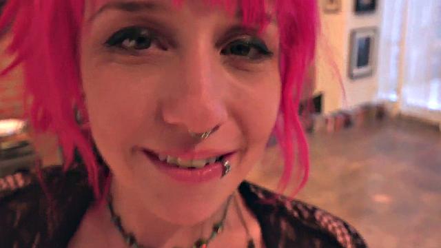 Pink hair babe with piercings sucks cock in closeup POV