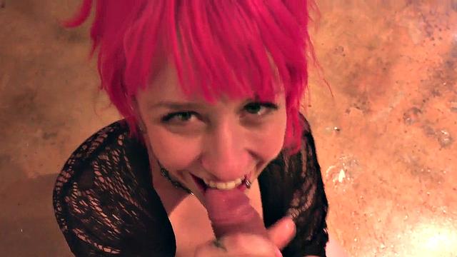 Pink hair babe with piercings sucks cock in closeup POV
