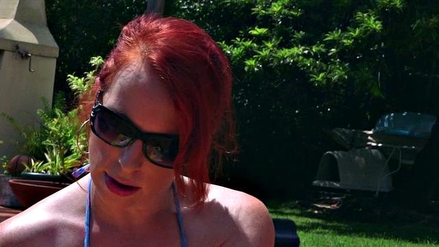 Red Vixen, busty MILF