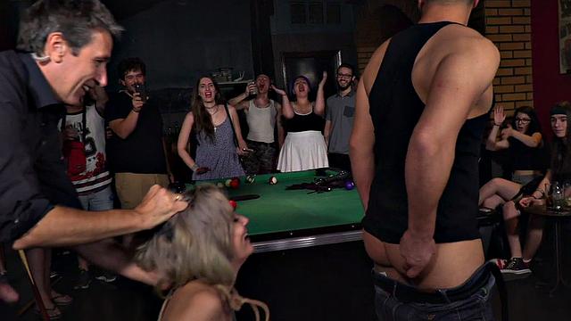Public BDSM slut rims guy's asshole in front of voyeurs