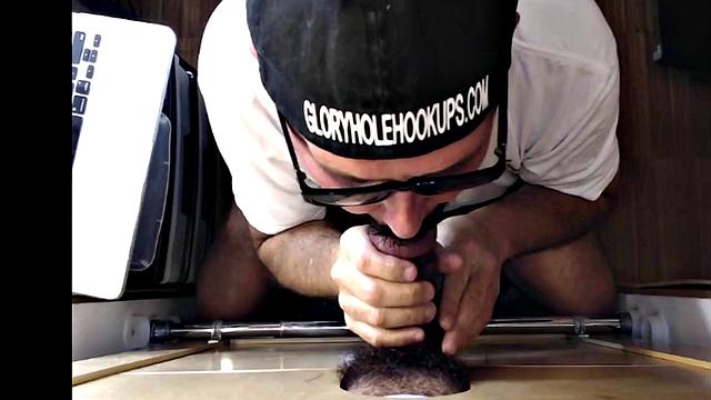 Mature gloryhole amateur blows BF's dick through hole