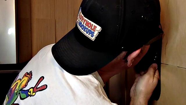 Mature gloryhole amateur blows BF's dick through hole