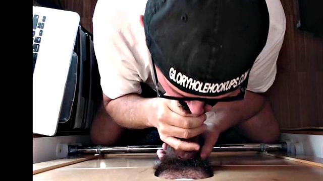 Mature gloryhole amateur blows BF's dick through hole