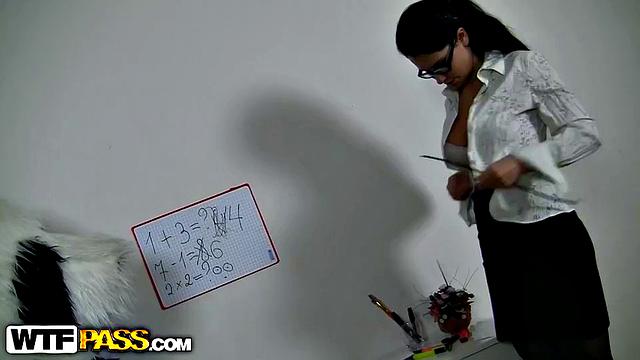 Teacher in black stockings masturbates