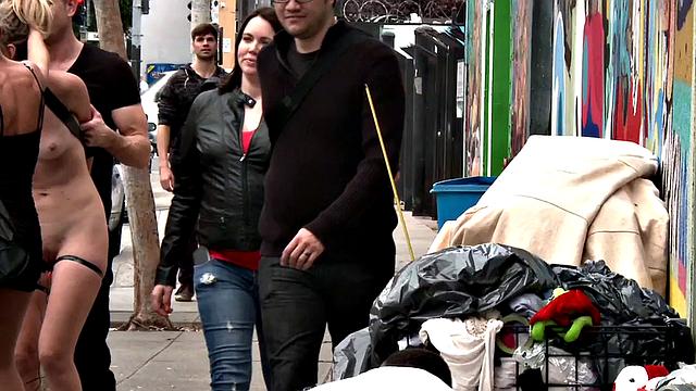 Public slutty MILF with estim on thighs whipped outdoors