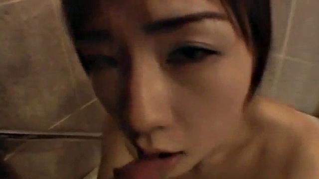 Bathing Asian teen sucks cock