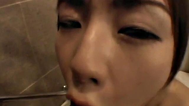 Bathing Asian teen sucks cock