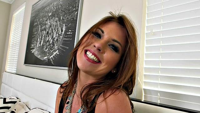 A petite babe in high heels take on a big one in her bedroom