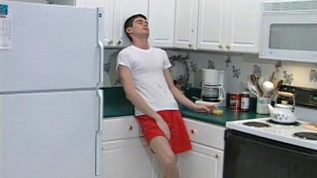 Cameron Kelley is a very cute and dark-haired 20-year-old with a nice 8.5-inch dick swinging between his legs. Once naked, he starts stroking his cock to a porn video and soon he's too busy concentrating on himself to watch the action.