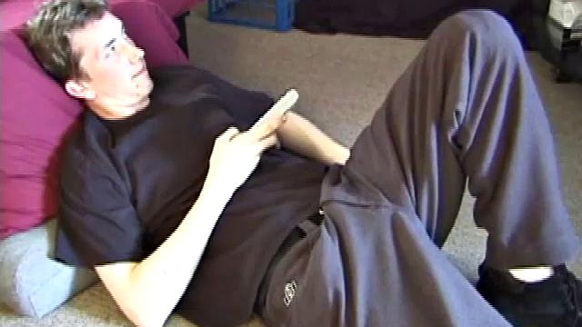 On the floor of his room Derek massages his crotch to himself. He soon pulls out his cock and strokes it until he cums on his stomach.