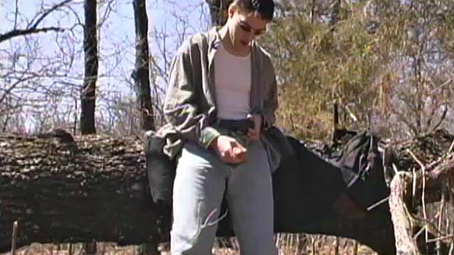 When 18 year old cutie Derrick Windsor is out hiking in the woods, he gets the urge to beat off. The young man looks around and sees he's alone, so he leans on a fallen tree and pulls his pants down just enough to work his growing cock.