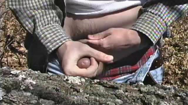When 18 year old cutie Derrick Windsor is out hiking in the woods, he gets the urge to beat off. The young man looks around and sees he's alone, so he leans on a fallen tree and pulls his pants down just enough to work his growing cock.