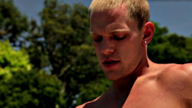 Shaven stud stroking his big shaft in outdoor jacuzzi