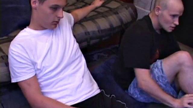 Buddies Lex and Gunner have sent their girls away for the weekend and are eager to spend some time together. The guys sit side-by-side, watching a porn video, and commenting on the show in front of them, while rubbing their growing dicks.