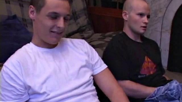 Buddies Lex and Gunner have sent their girls away for the weekend and are eager to spend some time together. The guys sit side-by-side, watching a porn video, and commenting on the show in front of them, while rubbing their growing dicks.