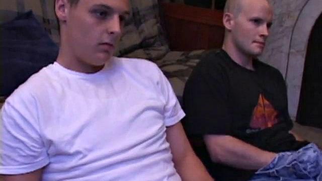 Buddies Lex and Gunner have sent their girls away for the weekend and are eager to spend some time together. The guys sit side-by-side, watching a porn video, and commenting on the show in front of them, while rubbing their growing dicks.