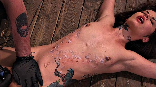 BDSM subject suffers in clothespins while pussyfingered