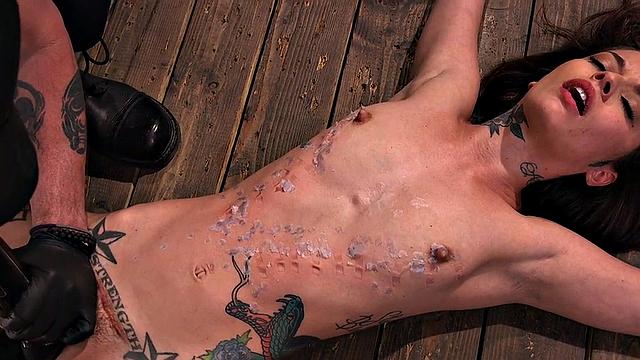 BDSM subject suffers in clothespins while pussyfingered