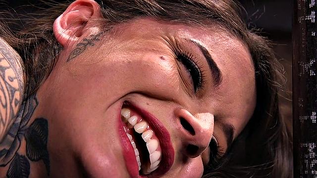 BDSM subject suffers in clothespins while pussyfingered