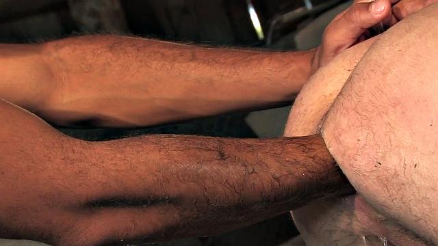 Fisting cowboy in gloves fists cocksucking bottom in the stable