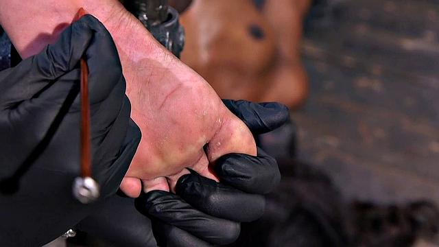 Ebony feet whipped by maledom in sensory deprivation