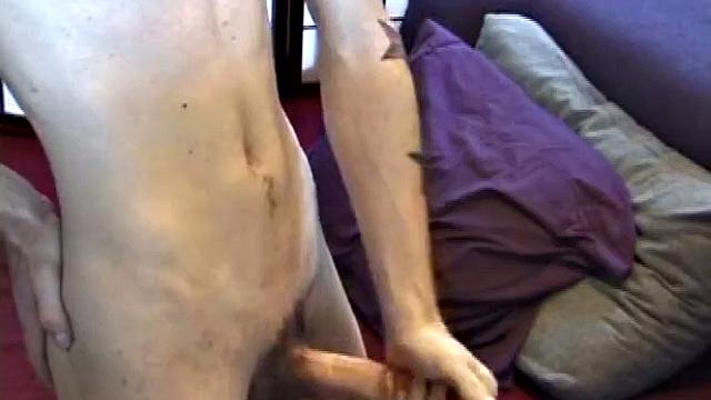 Dan's clothes quickly strip off and he pumps steadily with his left hand, showing the two stars tattooed on his forearm. Lubrication enhances Dan's serious stroke show.