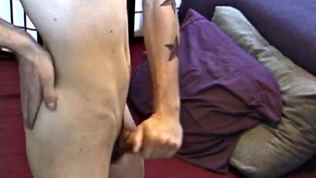 Dan's clothes quickly strip off and he pumps steadily with his left hand, showing the two stars tattooed on his forearm. Lubrication enhances Dan's serious stroke show.