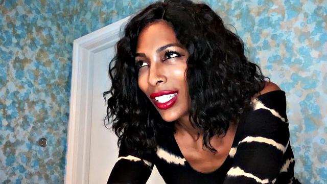 Busty black trans jerking off until cumming over tits