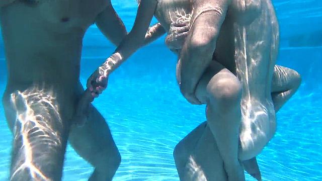Underwater bisex outdoor 3some with oiled tits babe