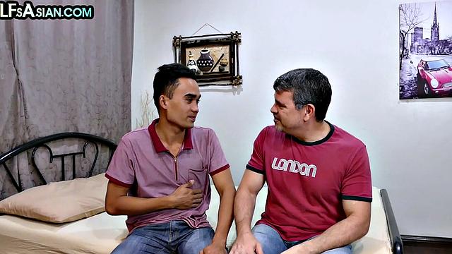 Real Asian twink enjoys anal with DILF in bedroom