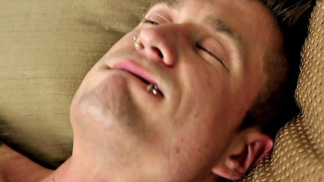 Pierced muscular jock tugging his in solo close up