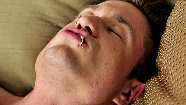 Pierced muscular jock tugging his in solo close up