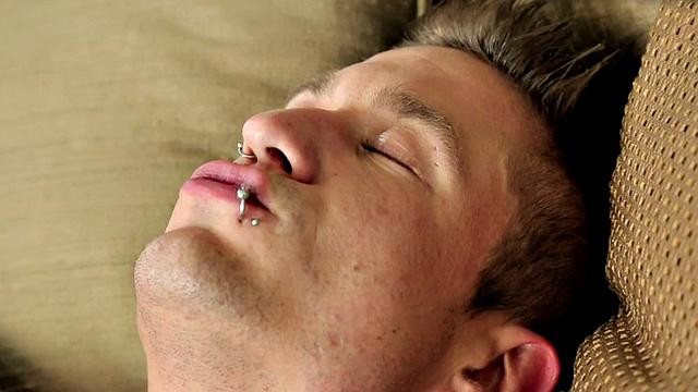 Pierced muscular jock tugging his in solo close up