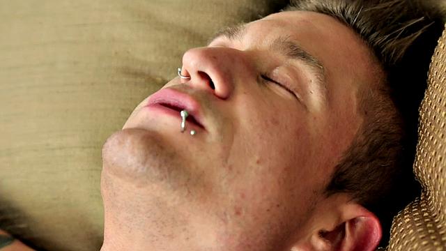 Pierced muscular jock tugging his in solo close up