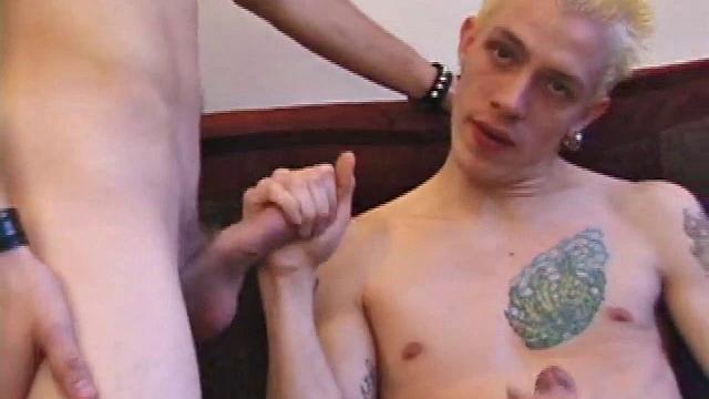 After they each work their bulge for a while, Roar is the first to lend a hand, and then a mouth. By the time they both strip and stroke side-by-side, Shane has already produced major leakage, before going down on Roar.