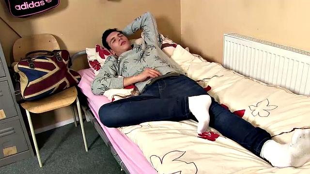 On his bed, horny young Jason Ward contemplates pleasuring himself. It isn't long before his pants are off and he's working on a boner.