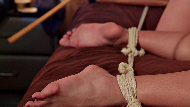 Whipping BDSM domina fucks Asian asshole with strapon