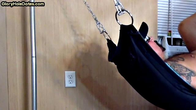 Tattooed daddy in sling gets fucked in ass at home