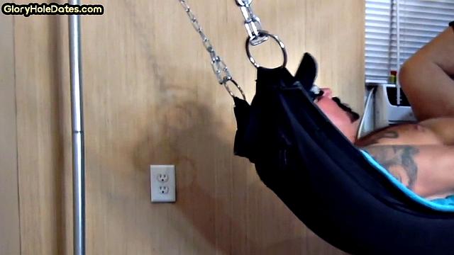 Tattooed daddy in sling gets fucked in ass at home